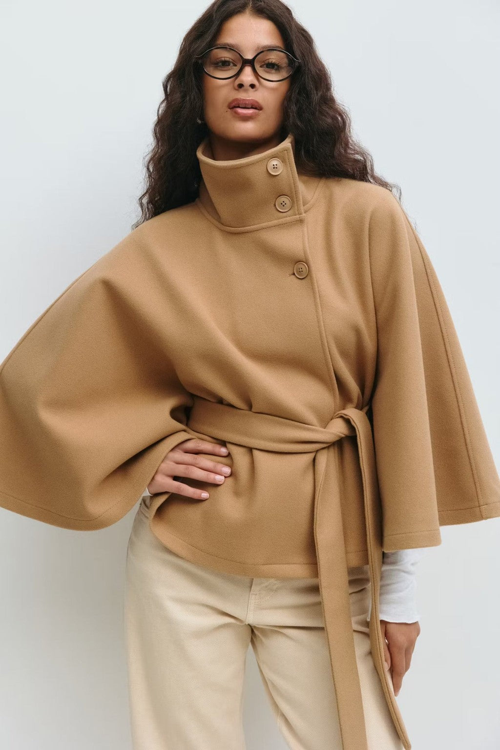 Model wearing the JANT belted poncho cape in khaki