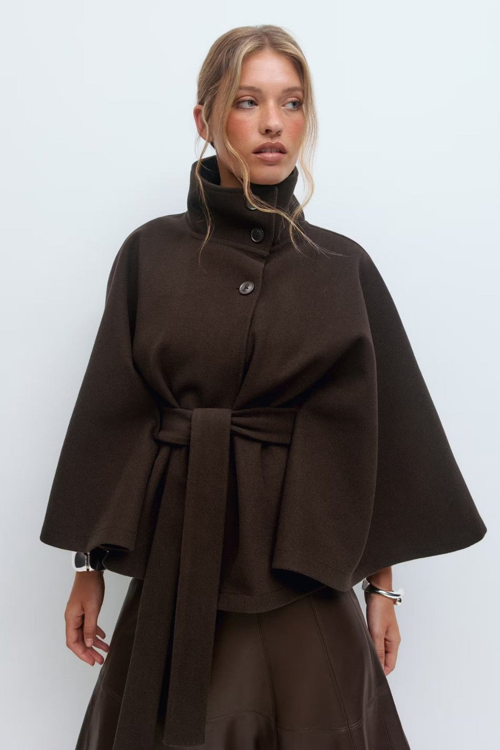 JANT model wearing the belted poncho cape